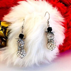 Sparkling snowman earrings.$10